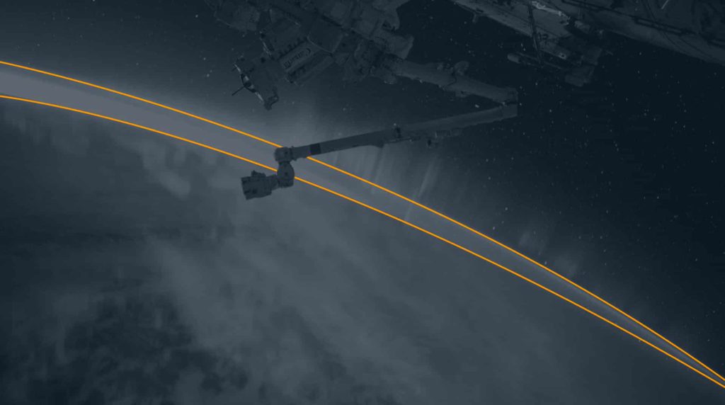 whats next for newspace in 2025? image shows a robotic arm on the international space station above the earth with the horizon picked out in colour